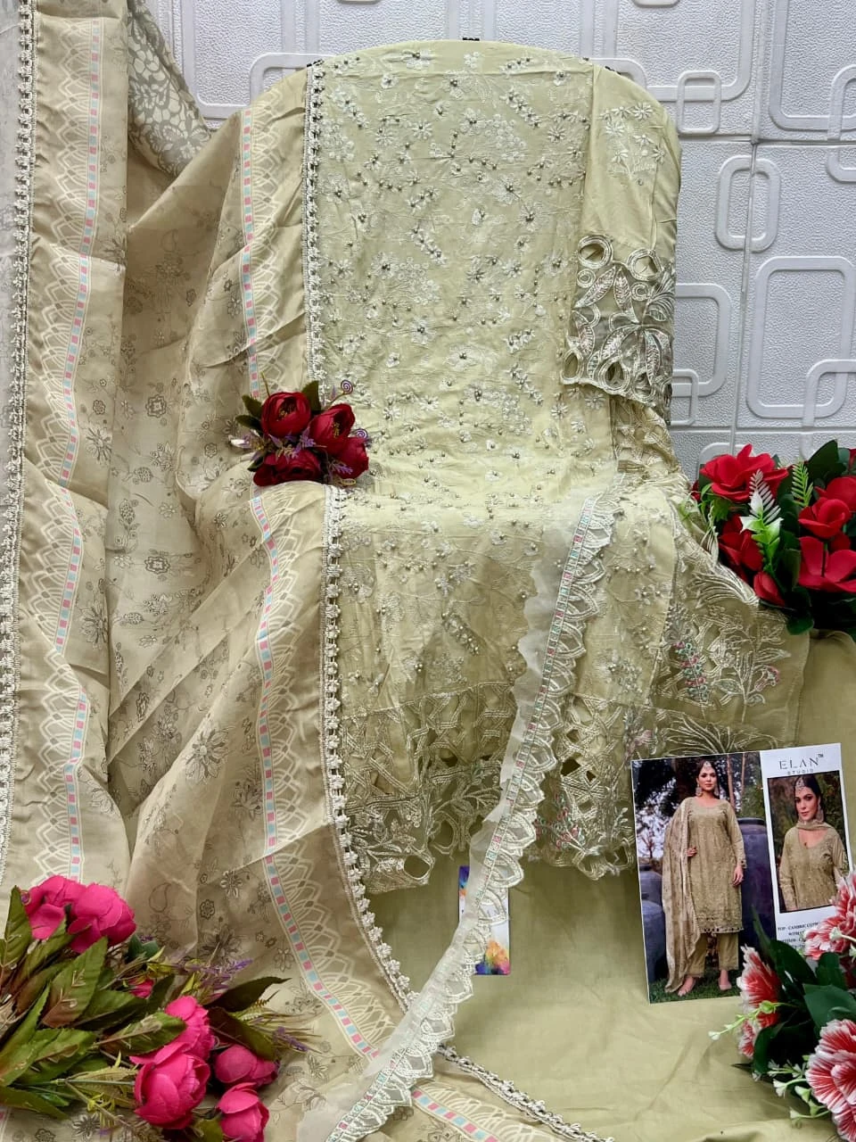 Elan Studio E 13, light green Pakistani salwar suit featuring heavy embroidery, pearl embellishments, cutwork borders, and a matching floral printed dupatta. - Pakistani Suit Design