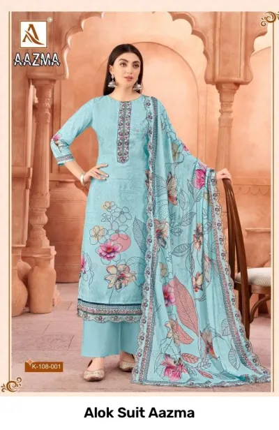 Alok Suit Aazma: Model wearing a light blue floral printed salwar suit with thread work neckline embellishments and a printed dupatta.