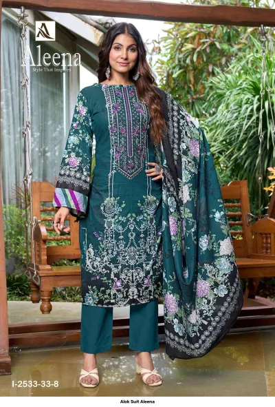 Alok Suit Aleena: Dark green salwar suit with floral print and thread work embroidery, styled with a coordinating floral printed dupatta.