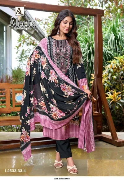 Alok Suit Aleena: Black salwar suit with floral print, thread work embroidery on the neckline, and a striped pink-bordered dupatta.