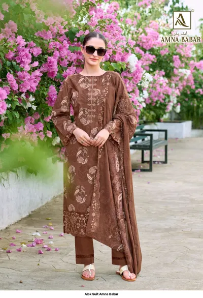 Alok Suit Amna Babar: Model wearing a brown salwar suit with floral print and heavy thread work on the hem and neckline.