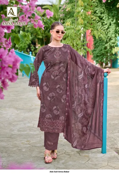 Alok Suit Amna Babar: Model wearing a dark brown salwar suit featuring floral prints and detailed thread work on the hem.