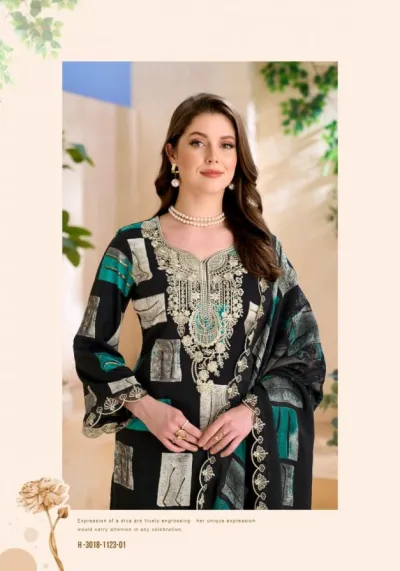 Alok Suit Black Diamond Vol 14: Model wearing black and teal printed salwar suit with heavy zari and thread work embroidery.