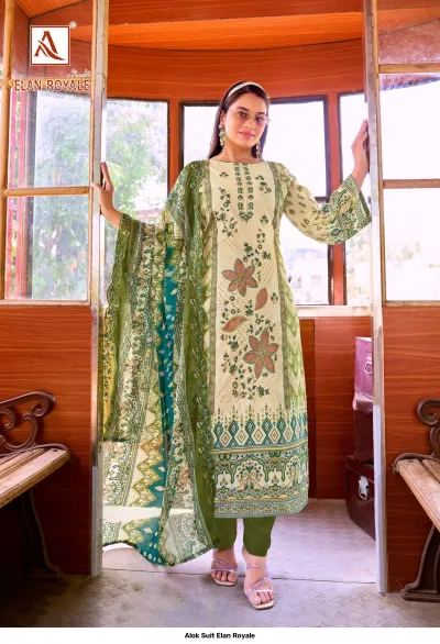 Alok Suit Elan Royale: Model wearing a beige and green printed straight-cut salwar suit with floral thread work and a patterned dupatta.