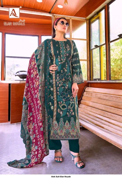 Alok Suit Elan Royale: Model wearing a dark green printed straight-cut salwar suit with floral thread work and a contrast maroon patterned dupatta.