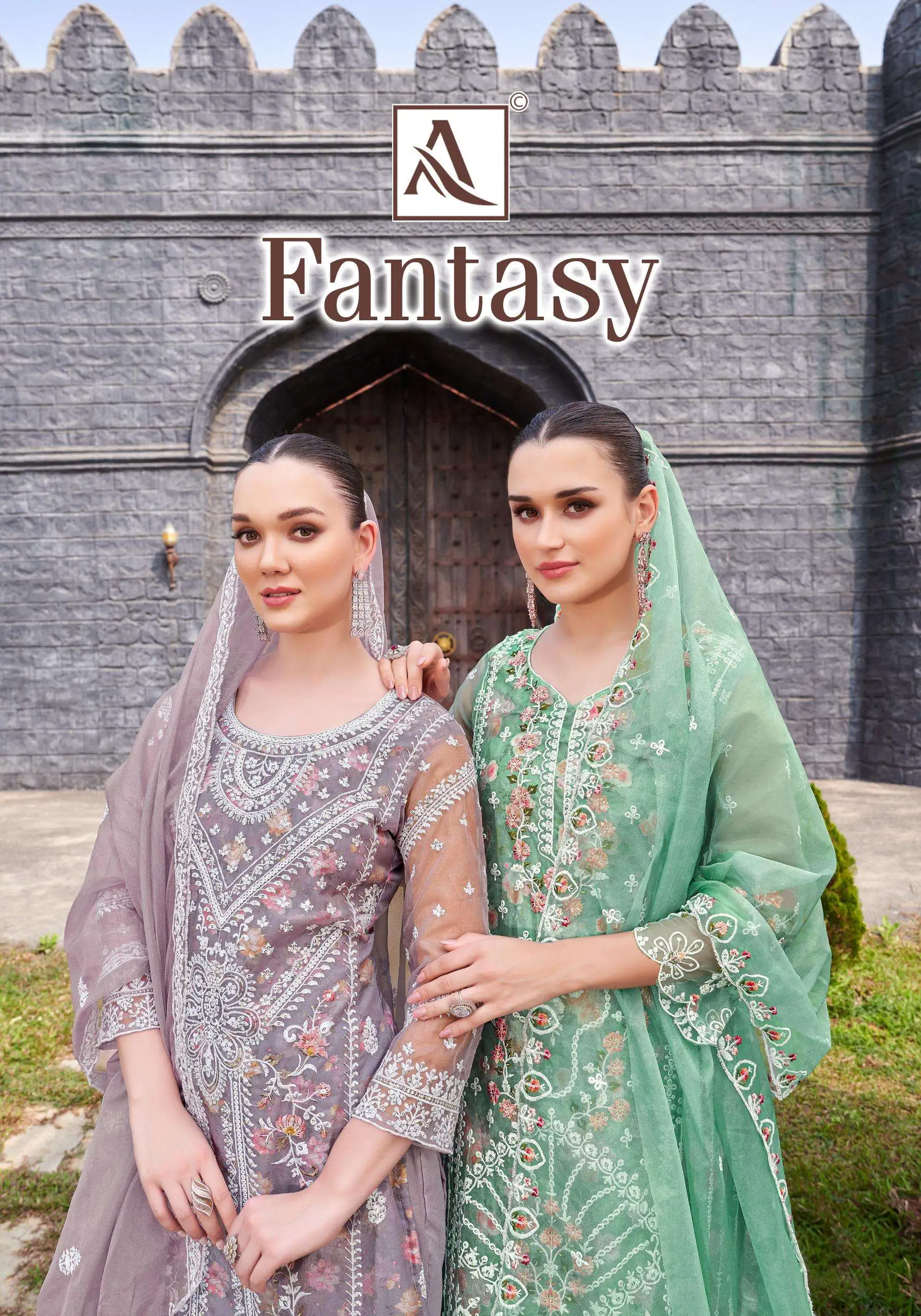 Alok Suit Fantasy: Catalog cover showing two women in embroidered floral salwar suits with sheer dupattas in mauve and green.