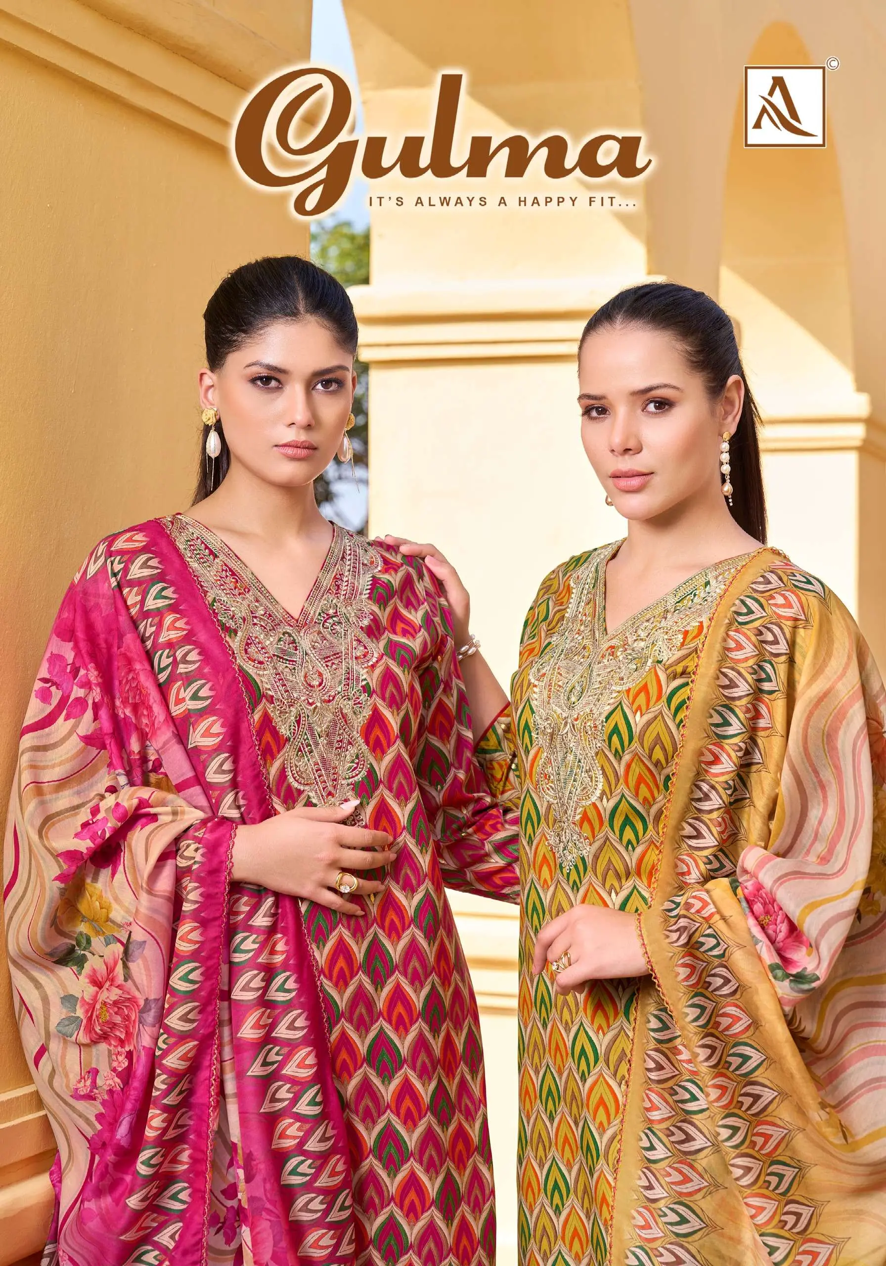 Alok Suit Gulma: A catalog cover featuring two models wearing printed salwar suits with intricate zari work embroidery and matching floral dupattas.