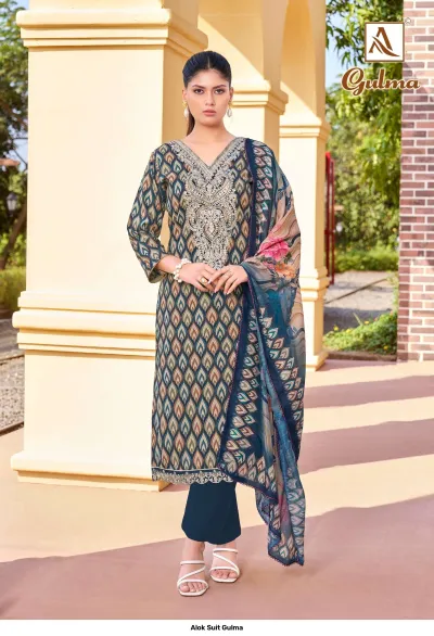Alok Suit Gulma: A blue printed salwar suit with zari work embroidery on the neckline, paired with a matching printed dupatta.