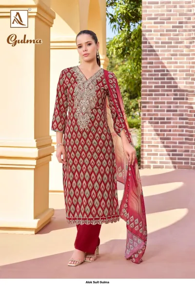 Alok Suit Gulma: A maroon and green printed salwar suit with zari work embroidery on the neckline and a matching printed dupatta.