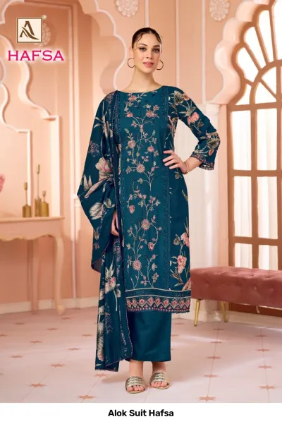 Alok Suit Hafsa: Teal blue salwar suit featuring floral patterns, thread work, and matching printed dupatta.