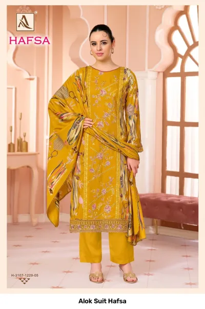 Alok Suit Hafsa: Mustard yellow salwar suit with floral prints, thread work, and matching dupatta.