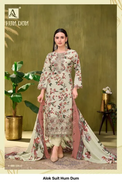 Alok Suit Hum Dum, cream floral printed salwar suit with detailed thread and zari work embellishments on the kurta hem.