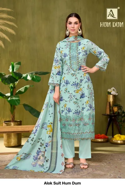 Alok Suit Hum Dum, light teal floral printed salwar suit with heavy thread and zari work embroidery on the kurta hem.