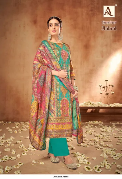 Alok Suit Jhilmil: A teal and multi-colored printed salwar suit featuring traditional ethnic motifs and a matching dupatta.