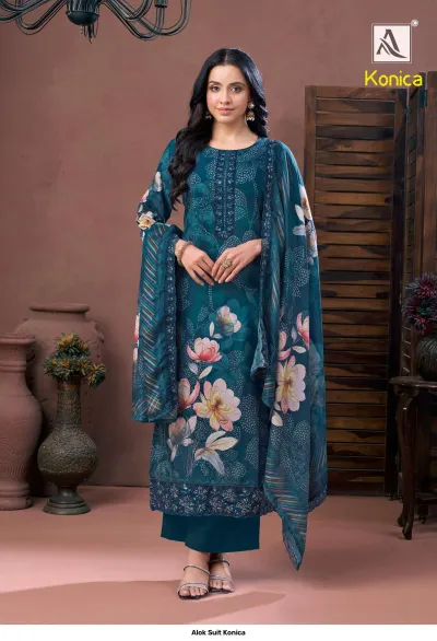 Alok Suit Konica teal printed salwar suit with floral motifs, embroidery work on the neck and hem, paired with dupatta.