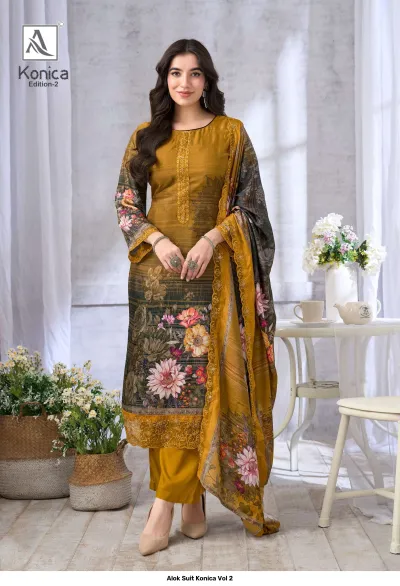 Alok Suit Konica Vol 2 mustard yellow salwar suit with floral patterns, featuring thread work and a coordinated printed dupatta.