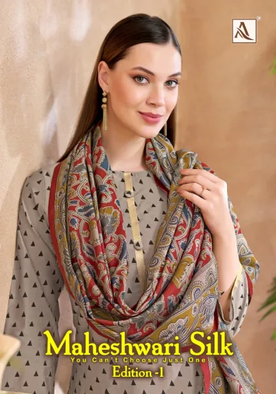 Alok Suit Maheswari Silk: A woman wearing a grey kurti with black triangle patterns and a red and green printed dupatta.