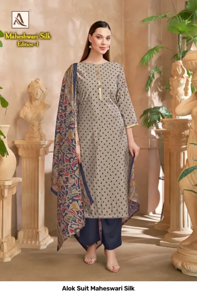 Alok Suit Maheswari Silk: A grey kurti with black triangle patterns, navy blue pants, and a navy blue floral printed dupatta.