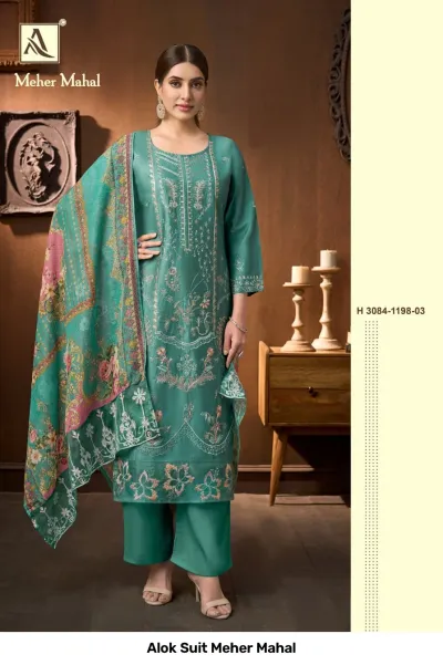 Alok Suit Meher Mahal: Teal green salwar suit with ornate thread work embroidery, straight cut style, and a matching floral printed dupatta.