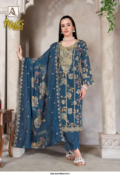 Alok Suit Mithai Vol 3, deep teal blue salwar suit with floral print, matching dupatta, and gold zari embroidery details.