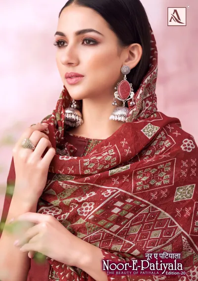 Alok Suit Noor E Patiyala Edition 20, close-up of a model wearing a maroon salwar suit with geometric printed dupatta and minimal embroidery.