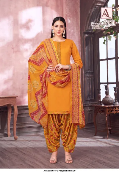 Alok Suit Noor E Patiyala Edition 20, mustard yellow salwar suit with a plain kurti and a vibrant patterned salwar and printed dupatta.