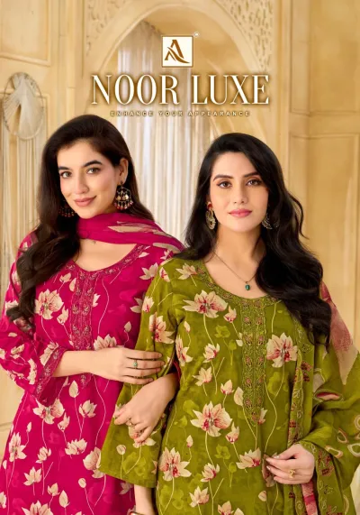 Alok Suit Noor Luxe: Catalog cover image featuring models wearing various colored floral printed salwar suits with intricate thread and zari embroidery.