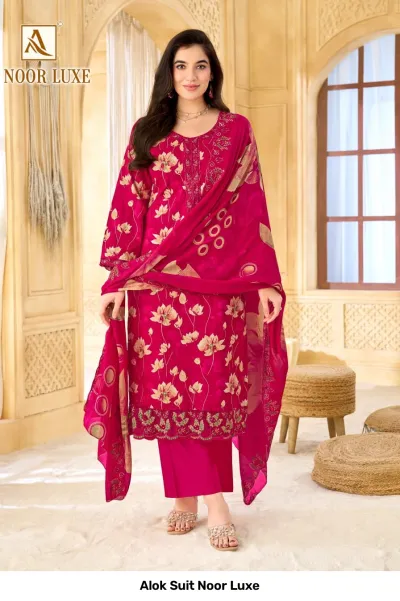 Alok Suit Noor Luxe: Pink salwar suit with floral print, featuring intricate zari and thread work embroidery on the neckline and hemline.