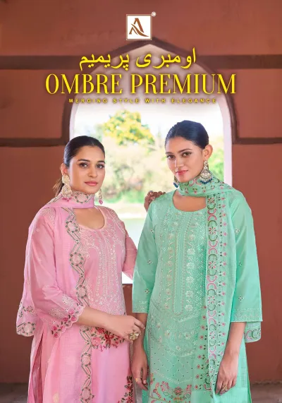 Alok Suit Ombre Premium: A catalog cover featuring two models wearing light green and pink salwar suits with thread work and floral details.