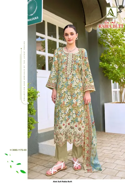 Alok Suit Rabia Butt: Sage green printed salwar suit with floral patterns, featuring intricate thread work on the neckline and hemline.