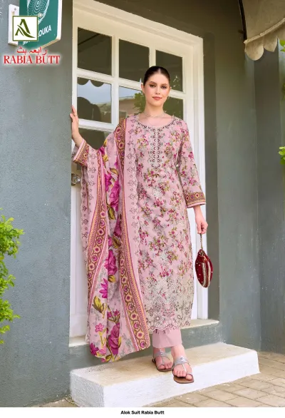 Alok Suit Rabia Butt: Soft pink printed salwar suit with floral patterns, paired with a matching dupatta and detailed hem embroidery.