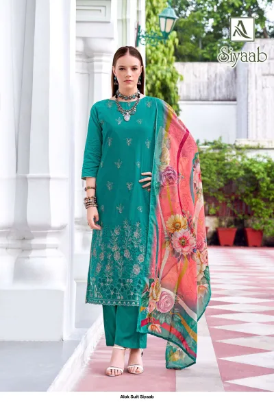 Alok Suit Siyaab: Teal salwar suit with thread work embroidery and a contrasting floral printed dupatta.