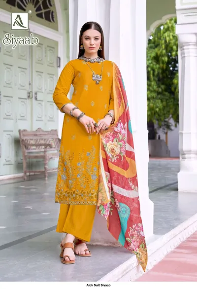 Alok Suit Siyaab: Mustard yellow salwar suit with thread work embroidery and a red-toned floral printed dupatta.