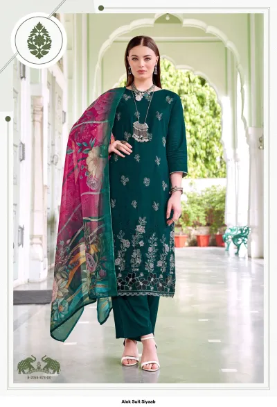 Alok Suit Siyaab: Dark green salwar suit with thread work embroidery and a pink and green floral printed dupatta.