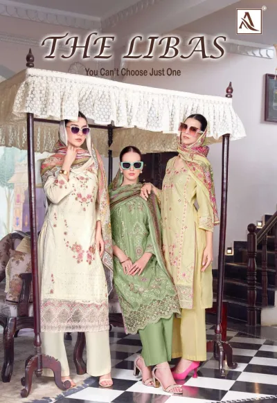 Alok Suit The Libas: Catalog cover showing three models wearing printed floral salwar suits with thread work in pastel shades.