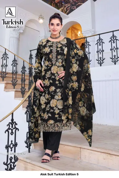Alok Suit Turkish Edition 5: Model wearing a black salwar suit with gold floral print and thread work embroidery on the hem.