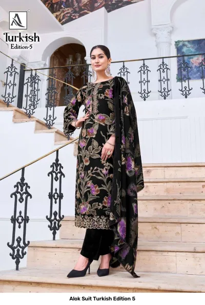 Alok Suit Turkish Edition 5: Model wearing a black salwar suit with purple floral print and detailed thread work on the hem.