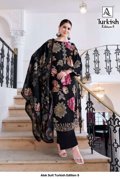 Alok Suit Turkish Edition 5: Model wearing a black salwar suit with a large multi-colored floral print and thread work embroidery.