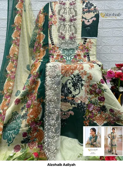 Alzohaib Aaliyah: Salwar suit material set in cream and green, featuring floral prints and detailed thread work embroidery.