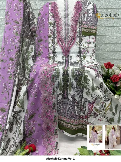 Alzohaib Karima Vol 1: A display of a white salwar suit dress material with purple and green floral prints and purple thread work on the neckline.