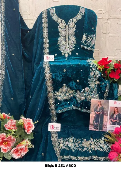 Bilqis B 231 ABCD teal velvet salwar suit adorned with detailed handwork embroidery, pearl detailing, and a coordinating embroidered dupatta.