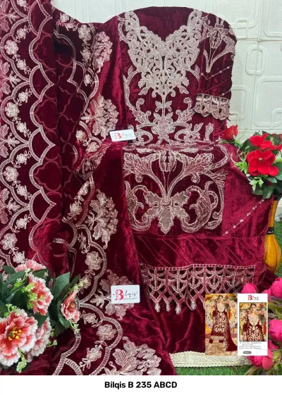 Bilqis B 235 ABCD: maroon velvet salwar suit featuring intricate silver thread embroidery, floral-inspired patterns, and scalloped hem detailing.