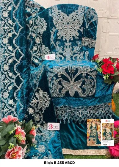 Bilqis B 235 ABCD: teal green velvet salwar suit decorated with extensive silver thread embroidery and floral embellishment patterns.