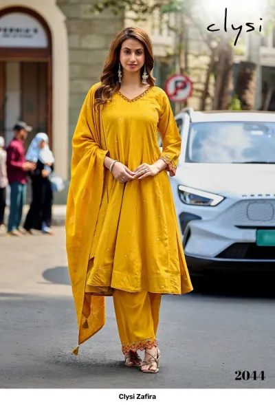 Clysi Zafira Vol 2044: Yellow salwar suit with plain kurta, matching pants, and a dupatta, accented with subtle thread work on the neckline.