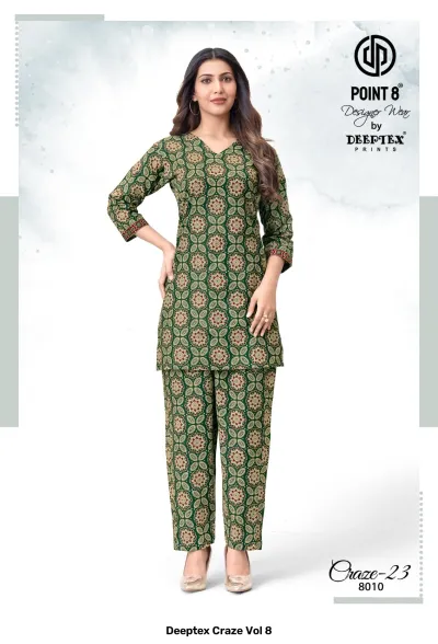 Deeptex Craze Vol 8: A dark green kurti and pant set with a small repeating circular motif.