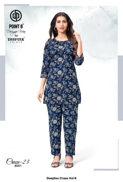 Deeptex Craze Vol 8: A navy blue floral printed kurti and pant set with three-quarter sleeves.