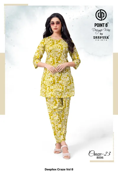 Deeptex Craze Vol 8: A mustard yellow and white floral printed kurti and pant set.