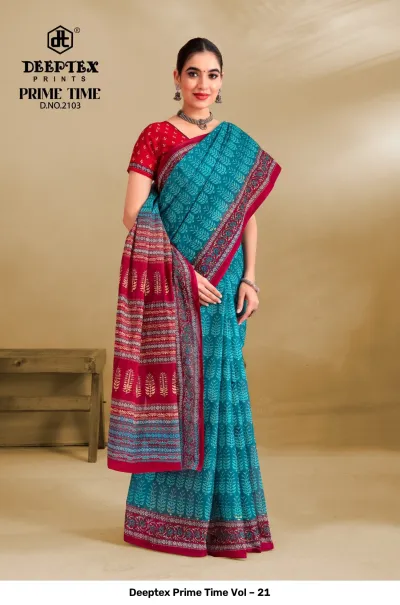 Deeptex Prime Time Vol – 21 teal and red printed cotton saree with small leaf motifs and a dark red patterned pallu.