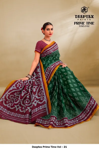 Deeptex Prime Time Vol – 21 forest green and maroon printed cotton saree featuring traditional geometric patterns and a gold border.