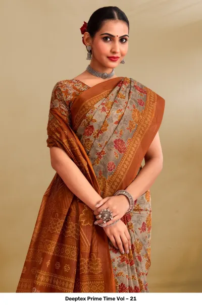Deeptex Prime Time Vol – 21 close-up of a model wearing a grey and burnt orange printed floral saree.